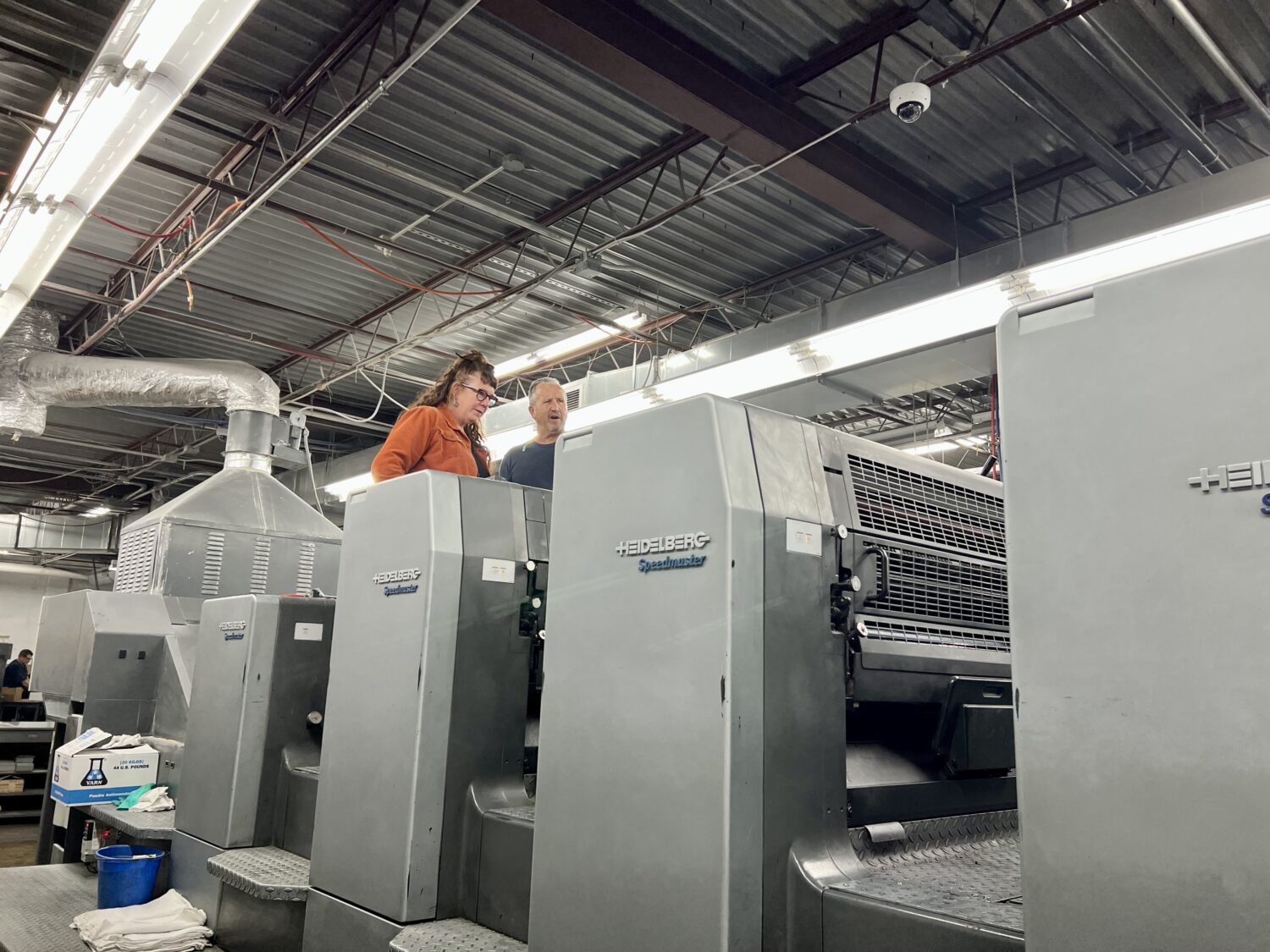 Liz at the print shop during the printing of our posters.